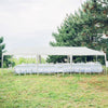 10 x 30 feet canopy tent with removable sidewalls, set up on grass for outdoor parties and weddings.