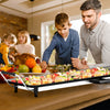 Family cooking together with the 35-inch electric griddle, featuring a non-stick surface and adjustable temperature.