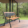 Outdoor cast iron patio bench with solid wood seat, featuring a durable design for comfortable seating in gardens.