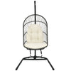 Hanging wicker egg chair with beige cushions, featuring a sturdy steel frame and designed for indoor or outdoor use.