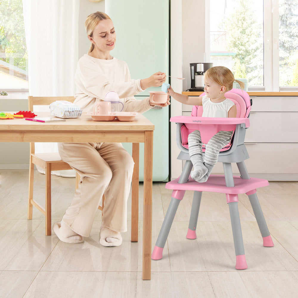 Convertible baby high chair in pink with adjustable tray, used for feeding, playtime, and easy cleaning.