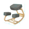Ergonomic gray kneeling chair with curved base, elastic cushion, and solid wood structure for improved posture and.