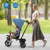 Child riding the blue 4-in-1 baby tricycle with adjustable canopy, showcasing its safety features and convertible seat.