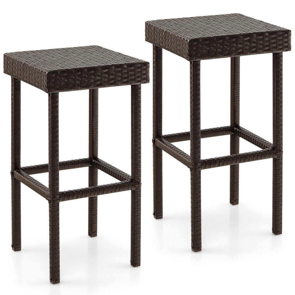 Set of two brown patio rattan wicker bar stools with sturdy steel frames, ideal for outdoor use by the poolside or.
