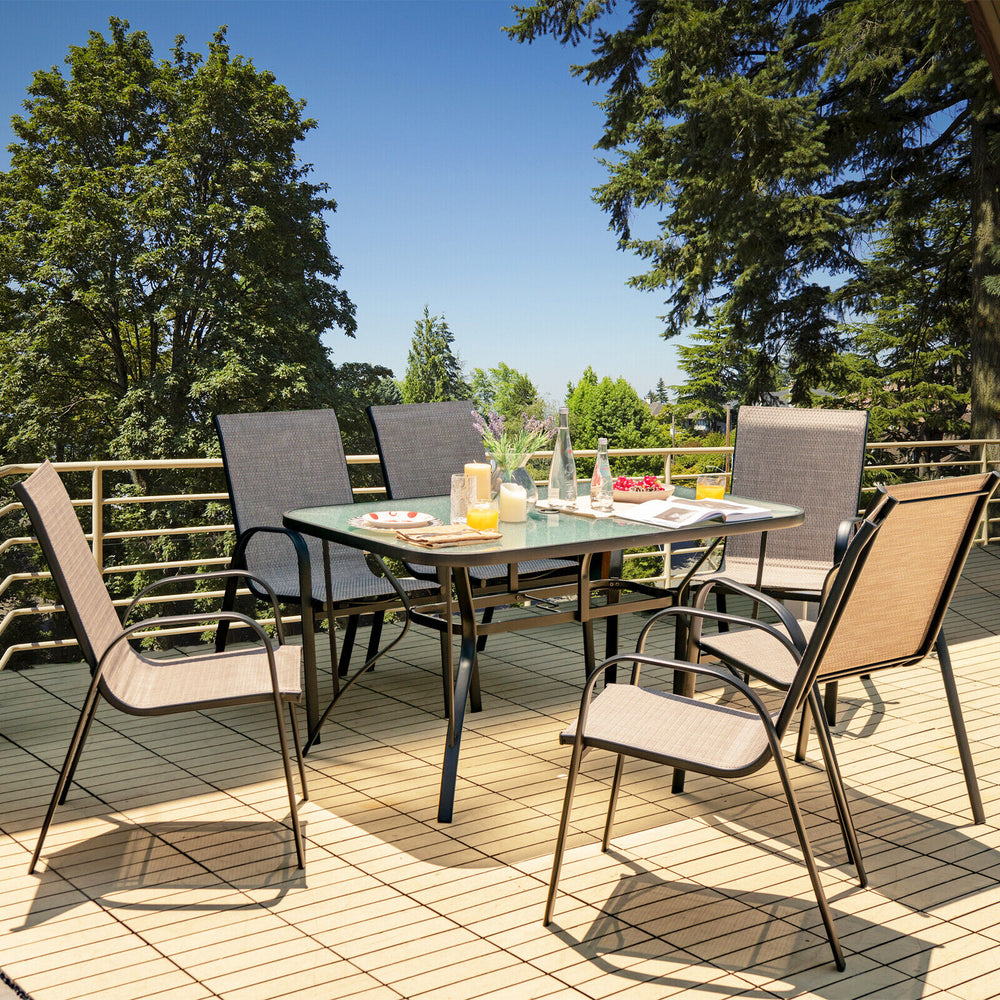 Single stackable patio dining chair featuring a breathable seat fabric and ergonomic design, ideal for outdoor comfort.