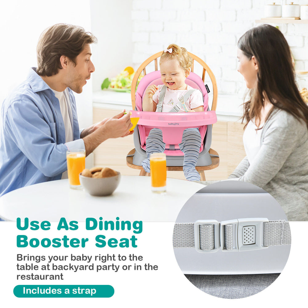 Convertible baby high chair in pink, used as a booster seat with adjustable tray for dining at home or restaurants.