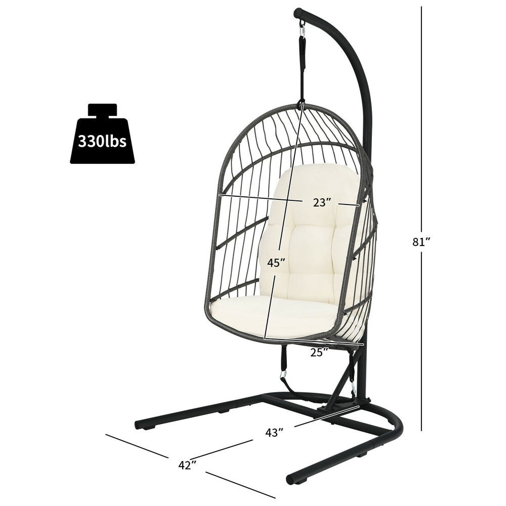 Hanging wicker egg chair with stand in beige, featuring a sturdy steel frame and comfortable cushions for outdoor or.