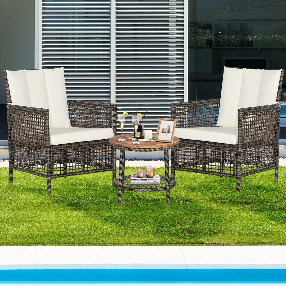 3-piece patio rattan furniture set featuring cushioned sofas and a wood tabletop, perfect for outdoor relaxation.