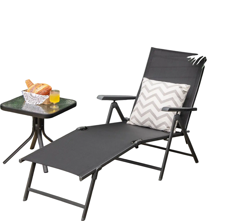 Foldable black chaise lounge chair with adjustable backrest and footrest, perfect for outdoor relaxation by the.