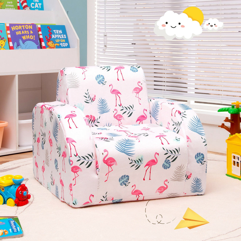 Convertible kid sofa bed in pink flamingo pattern, made of soft velvet, perfect for playroom or toddler relaxation.