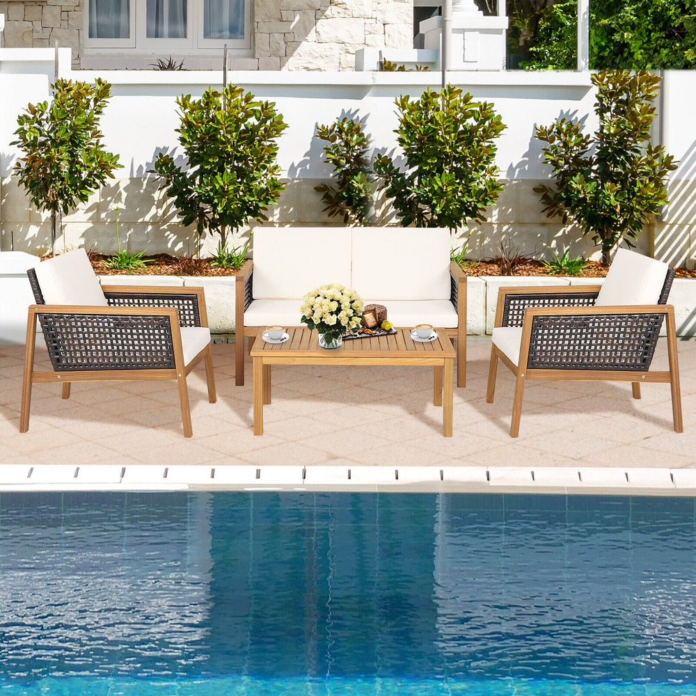 4-piece patio rattan furniture set with white removable cushions and acacia wood, perfect for outdoor relaxation by the.