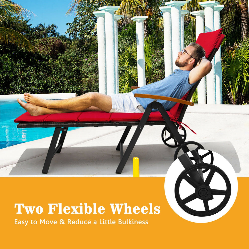 Folding patio rattan lounge chair with wheels in red, featuring adjustable backrest and comfortable cushions for.