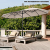 Double-sided 15 feet patio umbrella in beige with hand-crank system, providing ample shade for outdoor relaxation.