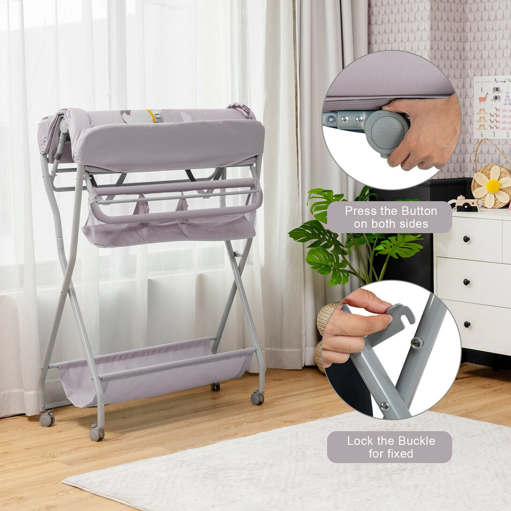 Baby changing table in gray with safety belt, foldable design, and storage basket for convenient baby care.