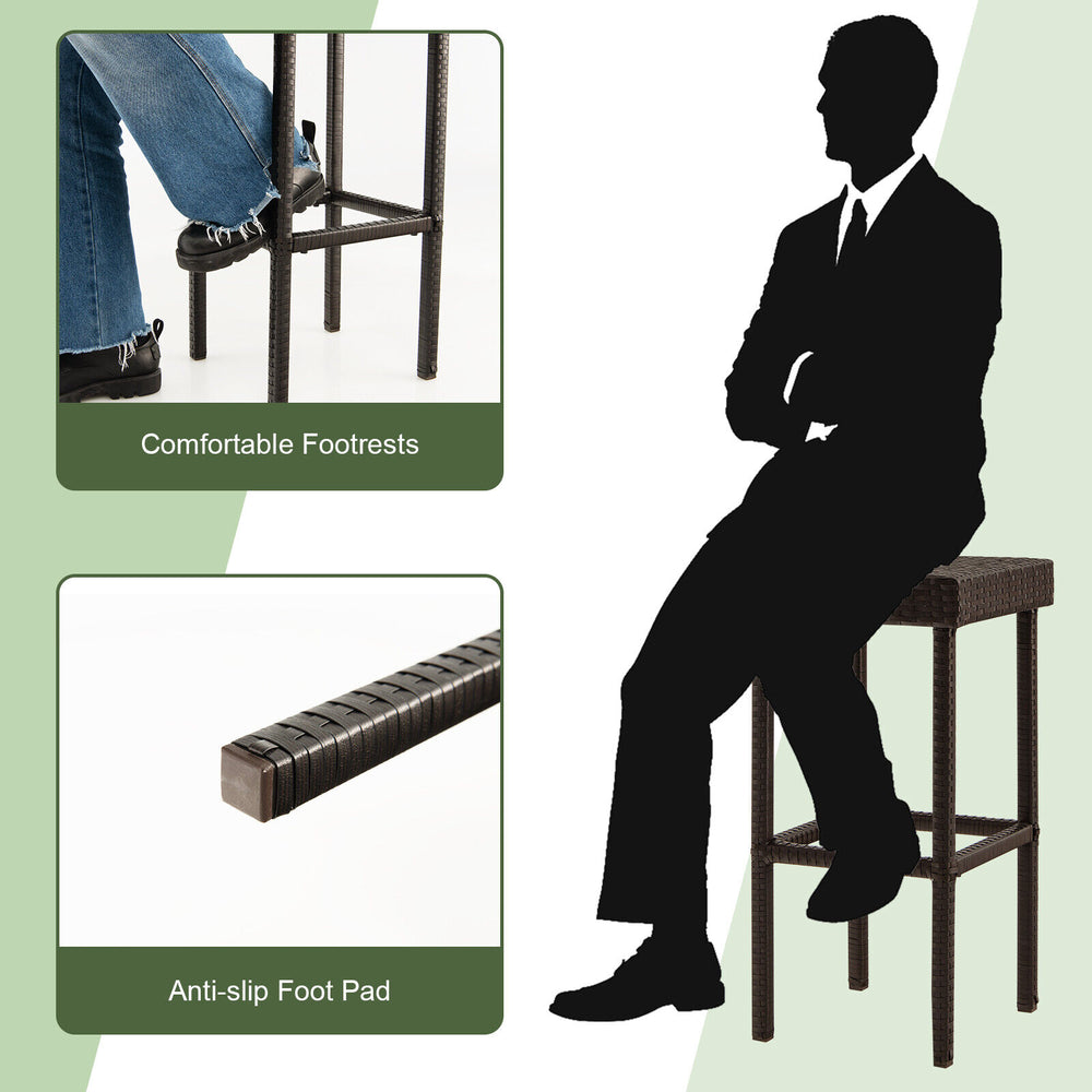 Brown rattan bar stool with comfortable footrests and anti-slip foot pads, ideal for outdoor patio use.