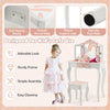 Kids vanity table set with tri-folding mirror in pink and white, featuring sturdy MDF construction and anti-tipping.