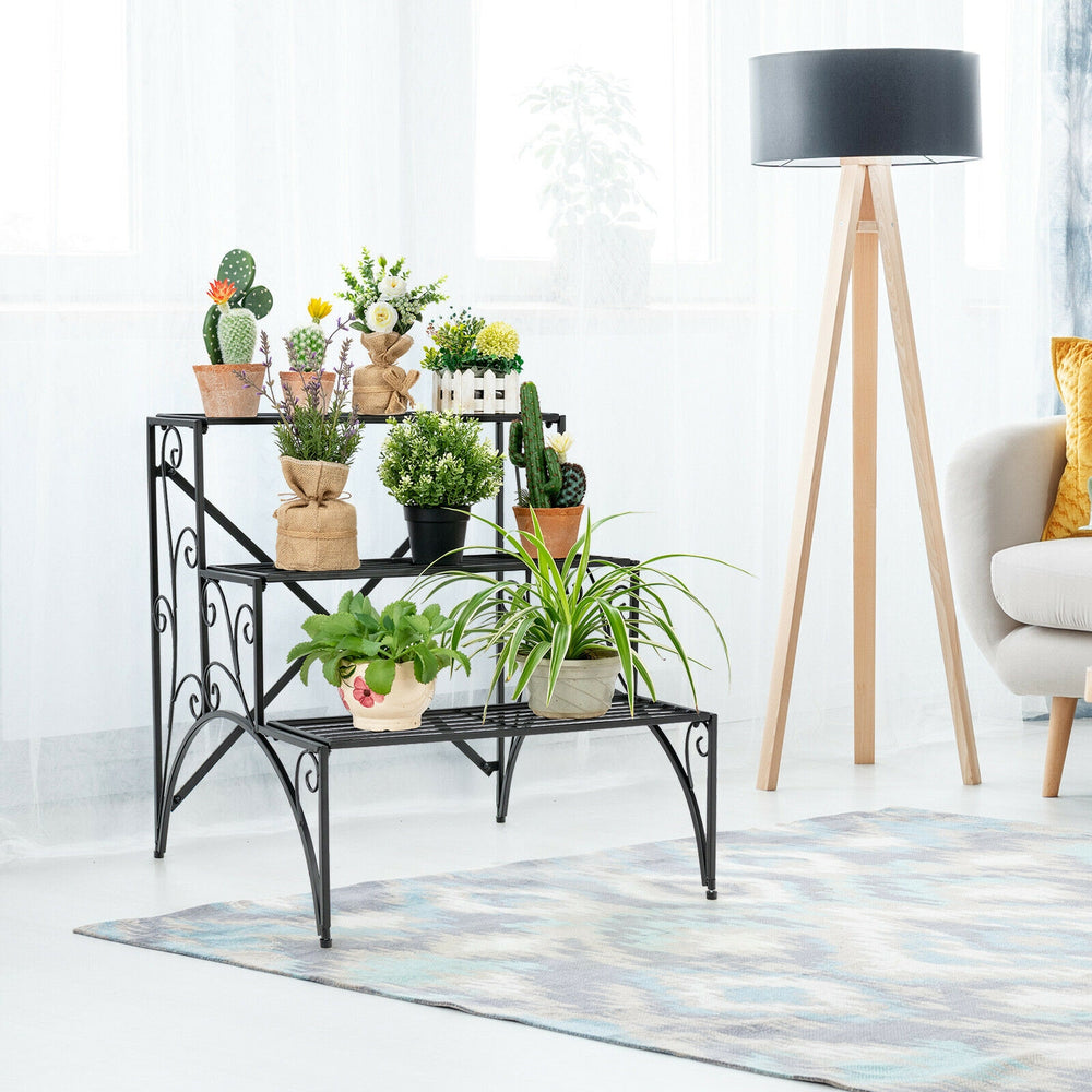 3-tier black metal plant stand with widened grid shelf, perfect for indoor or outdoor plant display and storage.