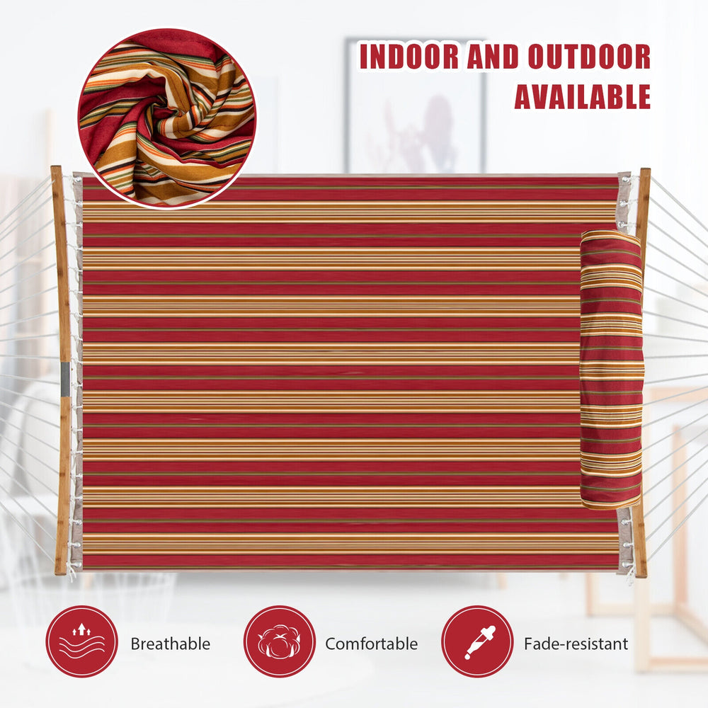 Outdoor hammock with detachable pillow in red, made of breathable, fade-resistant polyester for comfortable relaxation.