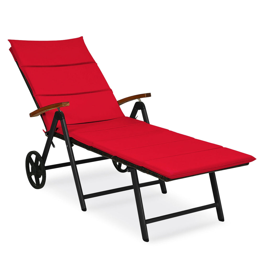 Red folding patio rattan lounge chair with wheels, adjustable backrest, and comfortable cushions for outdoor relaxation.
