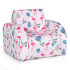 Convertible kids sofa bed in pink with flamingo patterns, made of soft velvet, perfect for playroom or living room use.