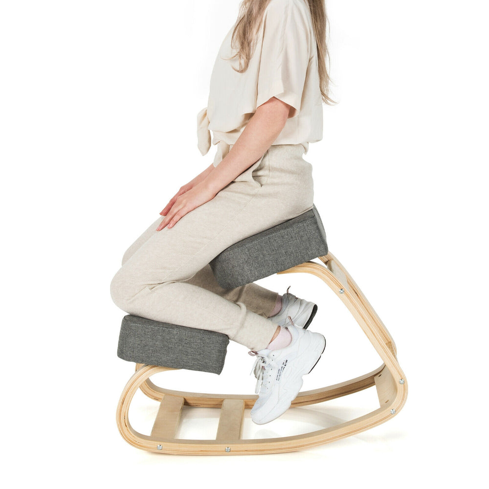 Ergonomic gray kneeling chair with curved base, promoting upright posture and comfort for home or office use.