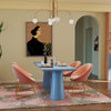 Modern pink velvet accent chairs with golden legs and height-adjustable bar stools, perfect for dining or kitchen.