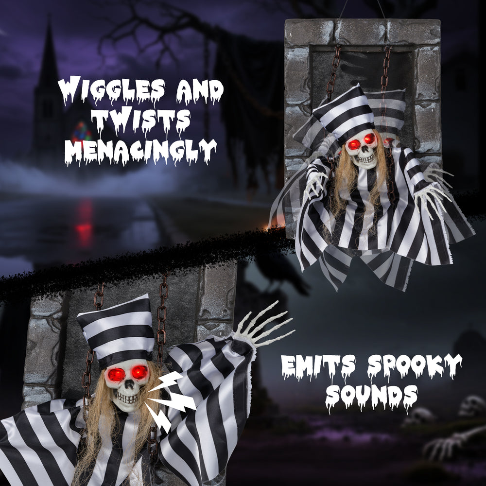 Animated 18-inch hanging skull prisoner decoration with LED eyes, emits spooky sounds, and wiggles menacingly.
