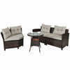 Outdoor wicker sofa set with soft cushions and a coffee table, perfect for patio relaxation and gatherings.