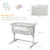 Travel portable baby bed side sleeper in beige with adjustable heights and detachable sidebar for parent interaction.