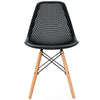 Black modern plastic hollow chair with beech wood legs, ergonomic mesh seat for breathability, ideal for dining rooms.