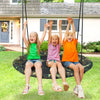 Three kids joyfully swinging on a 40-inch flying saucer tree swing, perfect for outdoor play and relaxation.