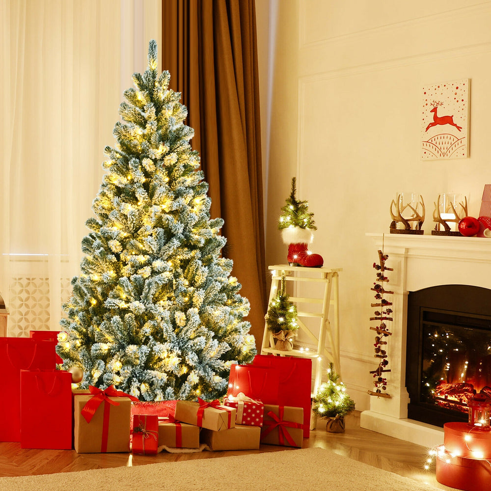 6-foot pre-lit snow flocked Christmas tree with 928 tips and metal stand, creating a warm festive atmosphere.