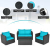Turquoise cushioned patio furniture set featuring a durable PE rattan frame, wide armrests, and a tempered glass table.