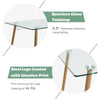 Modern rectangular dining table with a clear glass top and sturdy steel legs, ideal for home or office use.