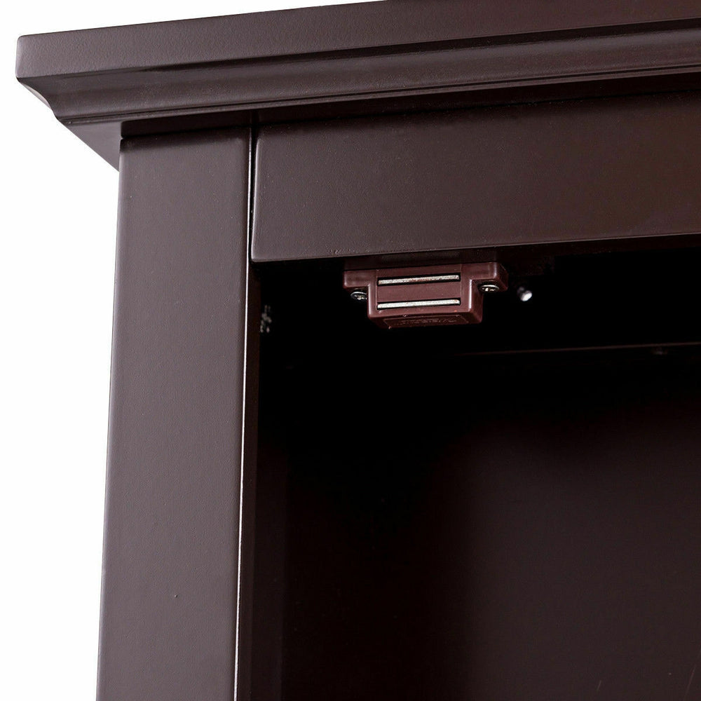 Close-up of the magnetic lock on the bathroom wall-mounted storage mirror medicine cabinet for secure door closure.