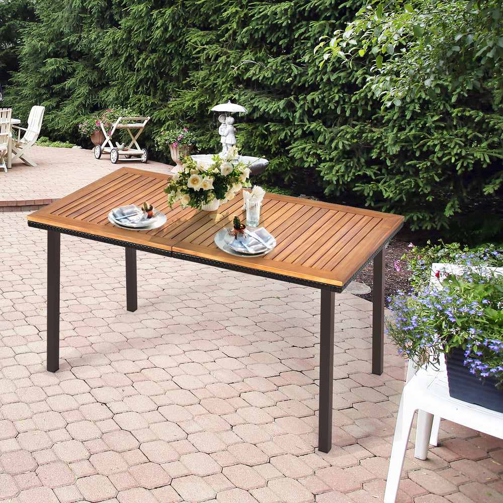 Acacia wood patio dining table with slatted surface and umbrella hole, perfect for outdoor gatherings in your backyard.