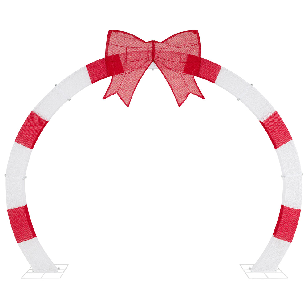 Christmas archway with large red bow and warm white LED lights, perfect for yards and gardens during the holiday season.