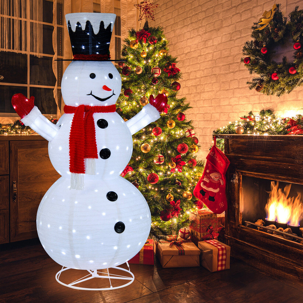 6-foot lighted snowman with a cheerful expression, adorned with a red scarf and top hat, ideal for festive holiday.