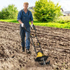 Electric tiller cultivator in action, showcasing its 10 Amp motor and 4 angled tines for effective soil cultivation.