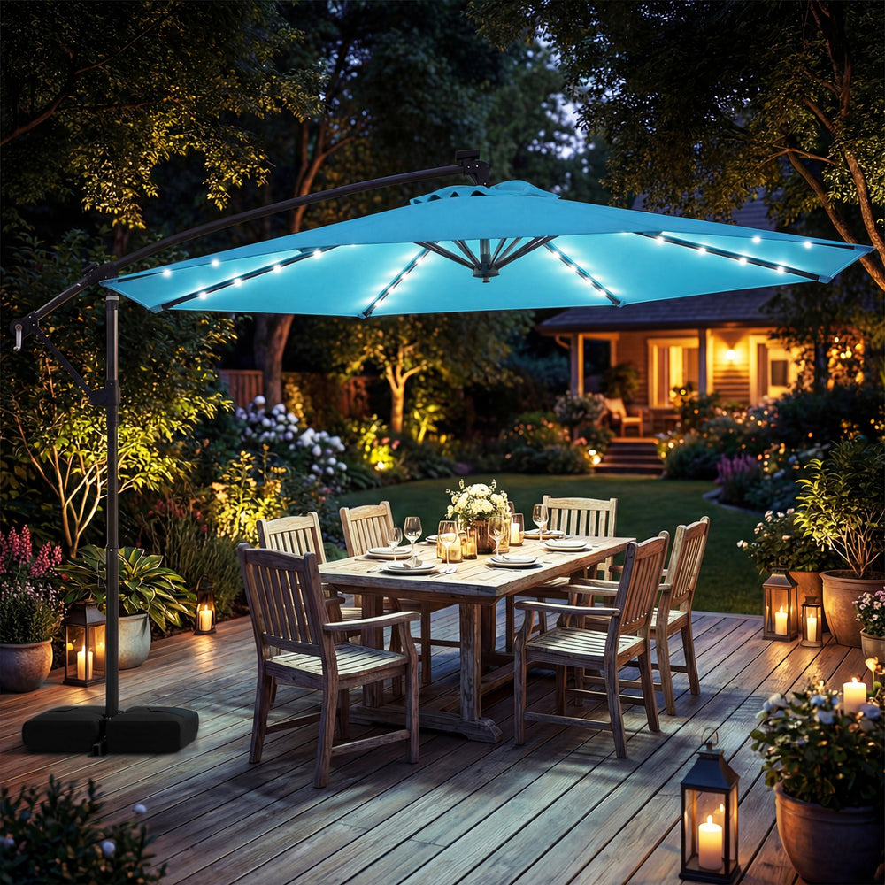 Turquoise 10 FT solar LED offset patio umbrella with a double-tier canopy, providing shade for outdoor dining.