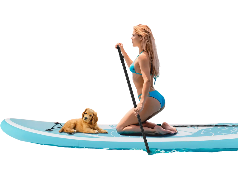 Inflatable stand-up paddle board with a non-slip deck, featuring a golden retriever and a woman paddling in the ocean.