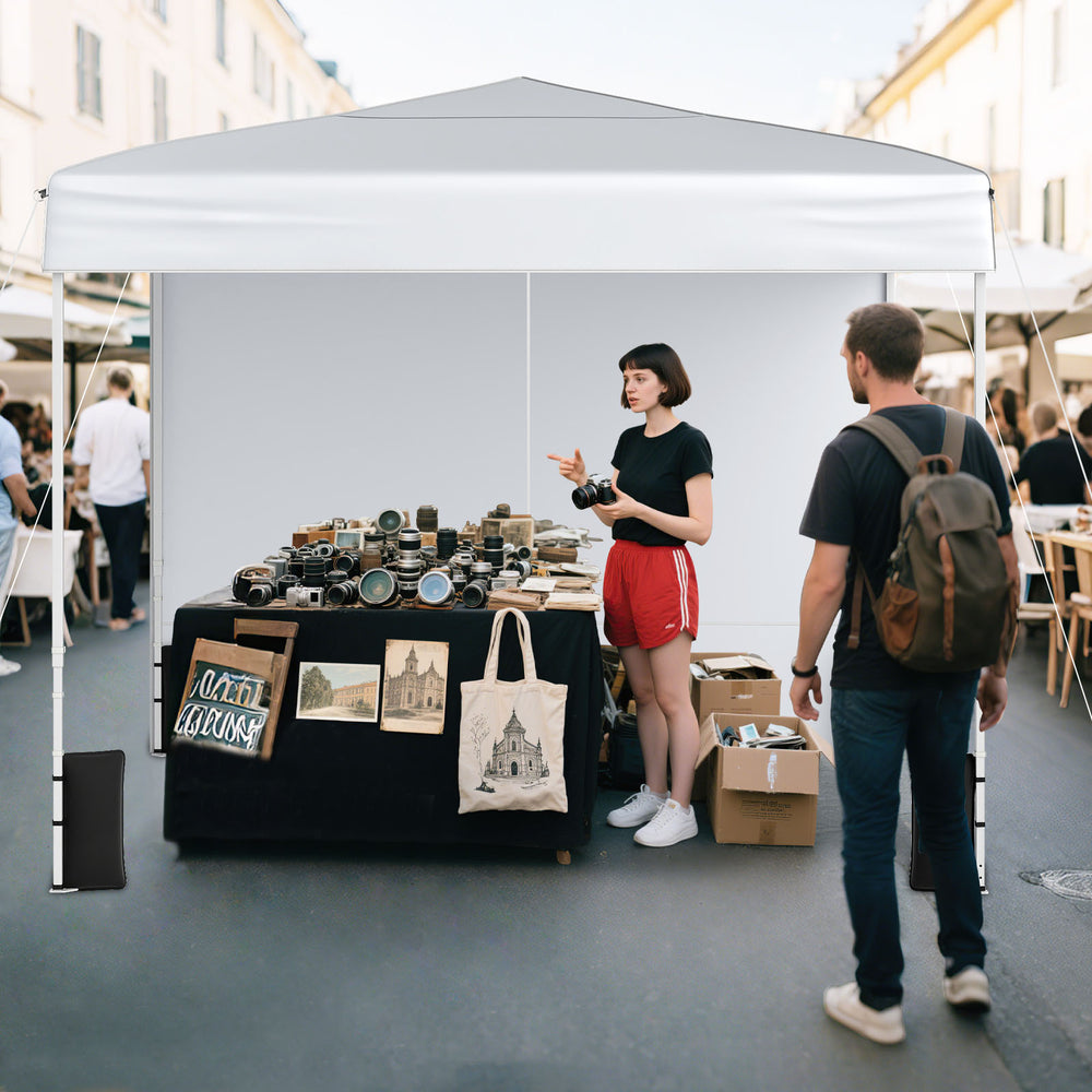 Pop up canopy tent with sidewalls, ideal for outdoor markets, offering sun protection and easy setup.