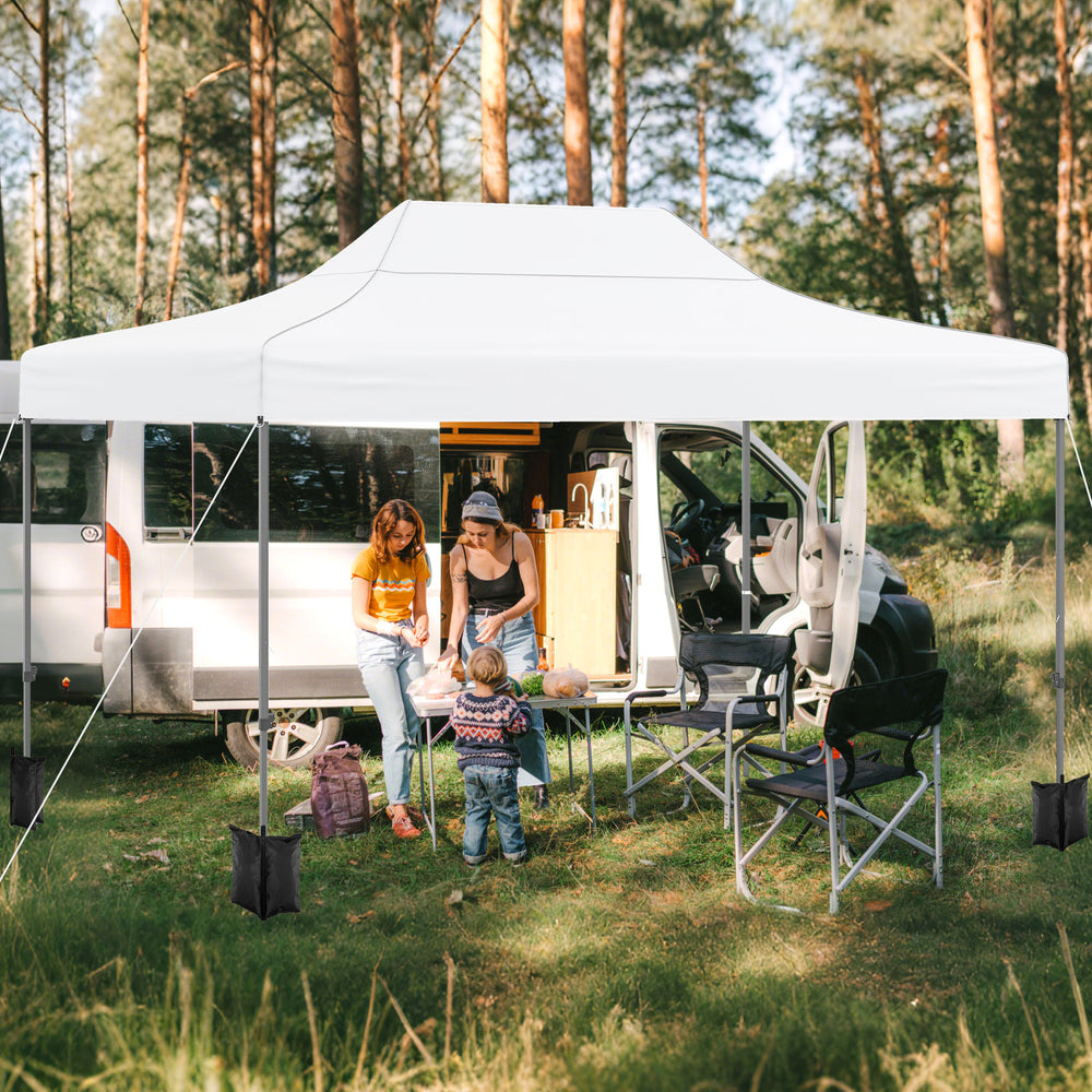 Pop up canopy tent in white, providing sunshade and shelter for outdoor activities like BBQs and camping.