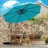 Turquoise 10 feet offset hanging umbrella providing 360° rotation and tilt, ideal for shielding outdoor dining areas.