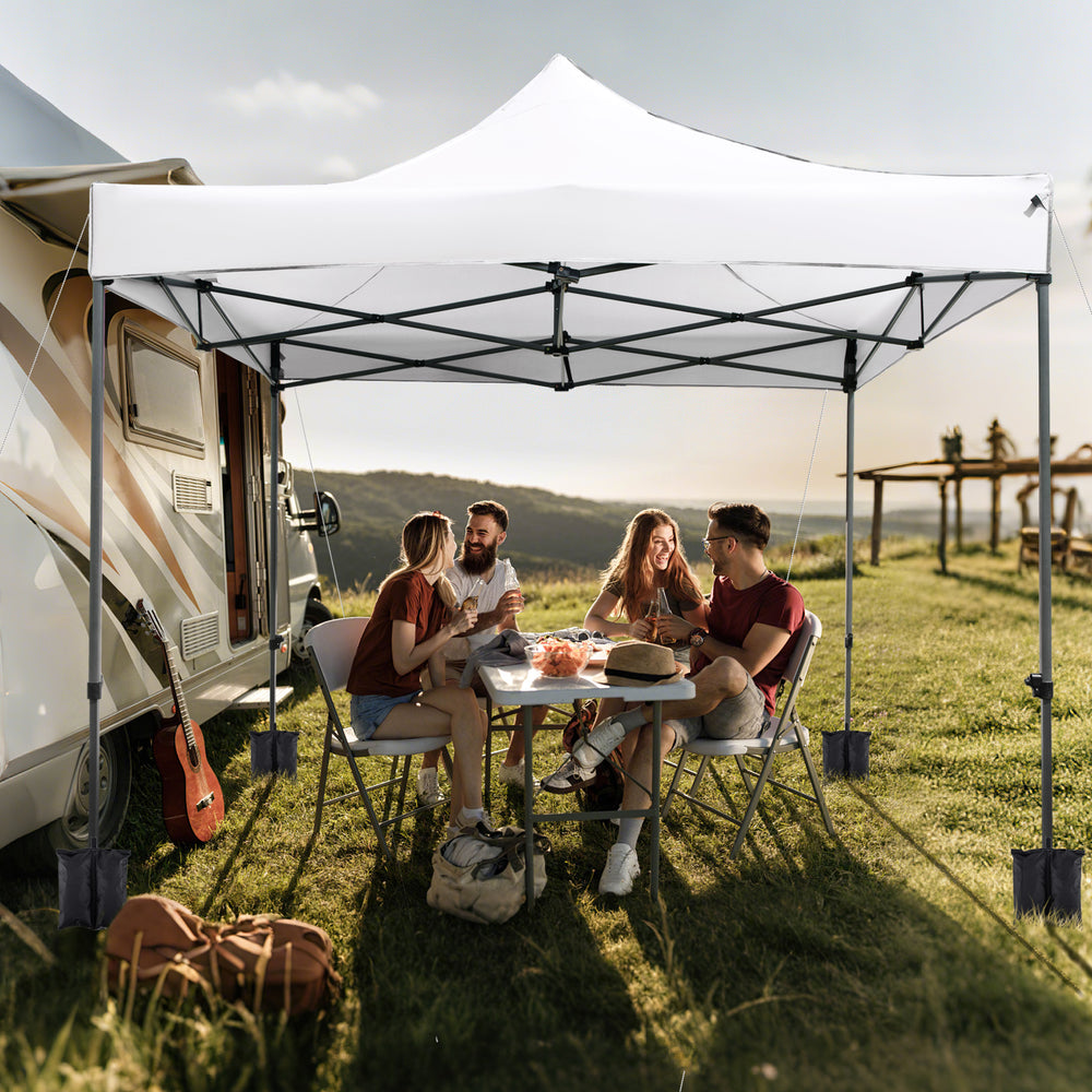 Outdoor 10 x 10 FT pop-up canopy tent in white, featuring a sturdy metal frame, ideal for picnics and events.