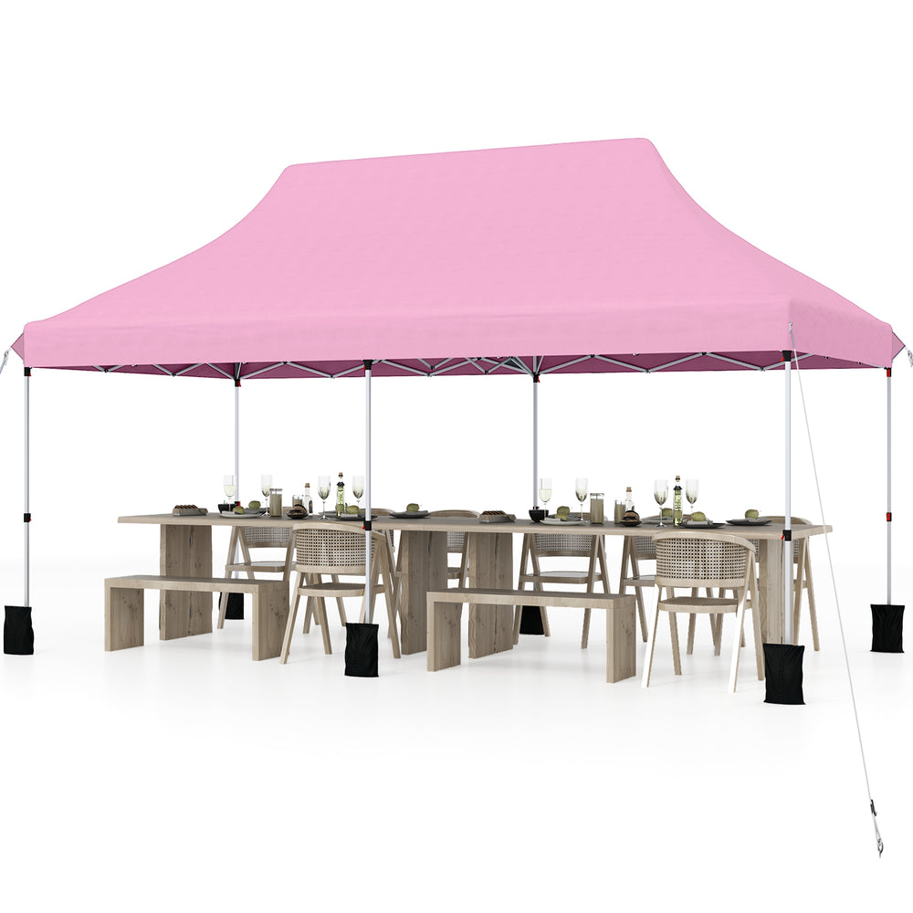 Large pink 10 x 20 ft pop-up canopy tent with tables, ideal for outdoor events, featuring water-resistant fabric and.