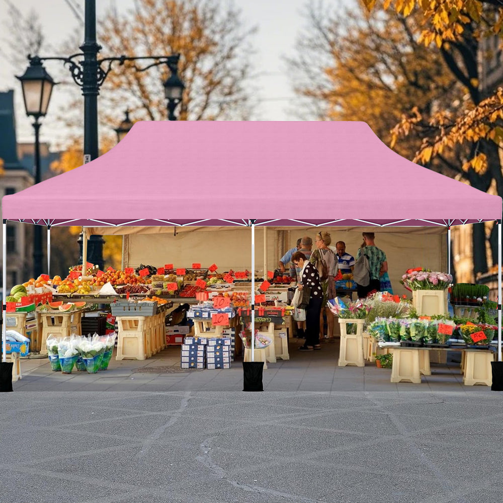 Pink 10 x 20 ft pop-up canopy tent providing shelter for outdoor events, featuring a durable water-resistant design.
