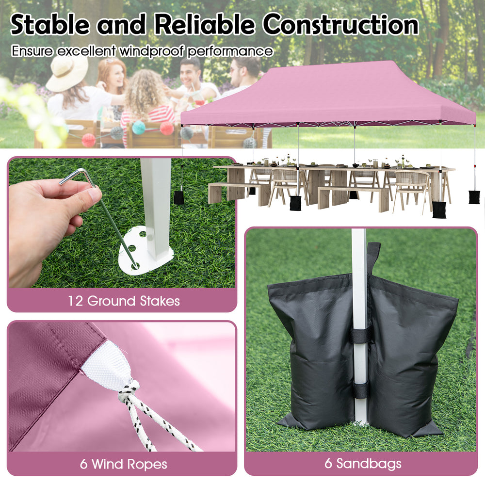 Pop-up canopy tent with pink oxford fabric, featuring ground stakes, wind ropes, and sandbags for outdoor events.