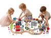 Children play with the 110-piece wooden train table featuring vehicles, figures, and traffic signs for interactive learning.