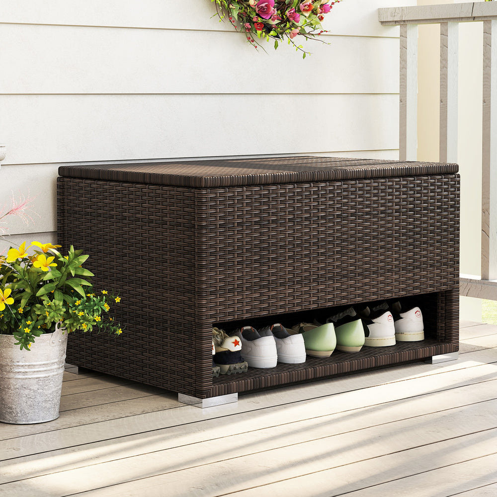 PE rattan storage bin with waterproof liner, featuring a shoe rack and soft close gas rod, perfect for patio.